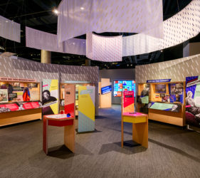 Exhibit space with color graphics and overhead banners