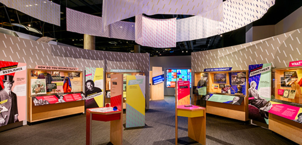 Exhibit space with color graphics and overhead banners