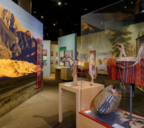 Exhibit overview with wooden horse interactive at the center
